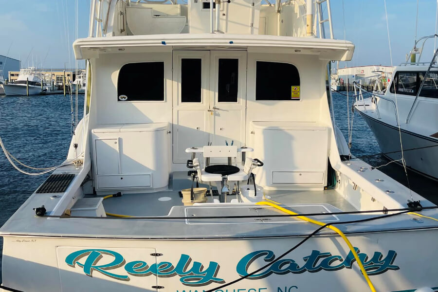 Transom Picture of boat showing fighting chair, deck space and entrance to cabin on boat