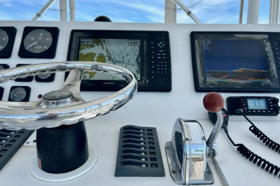 Picture of fly bridge showing steering and navigation