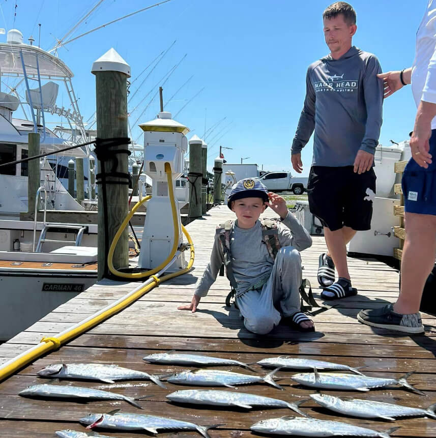 Young anglers with inshore catch of spanish mackerel.
